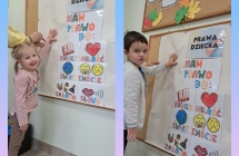 Sowki odrysowuja raczki na plakacie o Prawach Dziecka