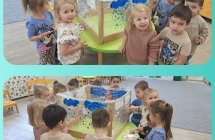 Sowki maluja farbami krople deszczu na folii streczowej