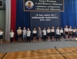 Szesciolatki  z gr. IX na tle napisu -To byly piekne dni